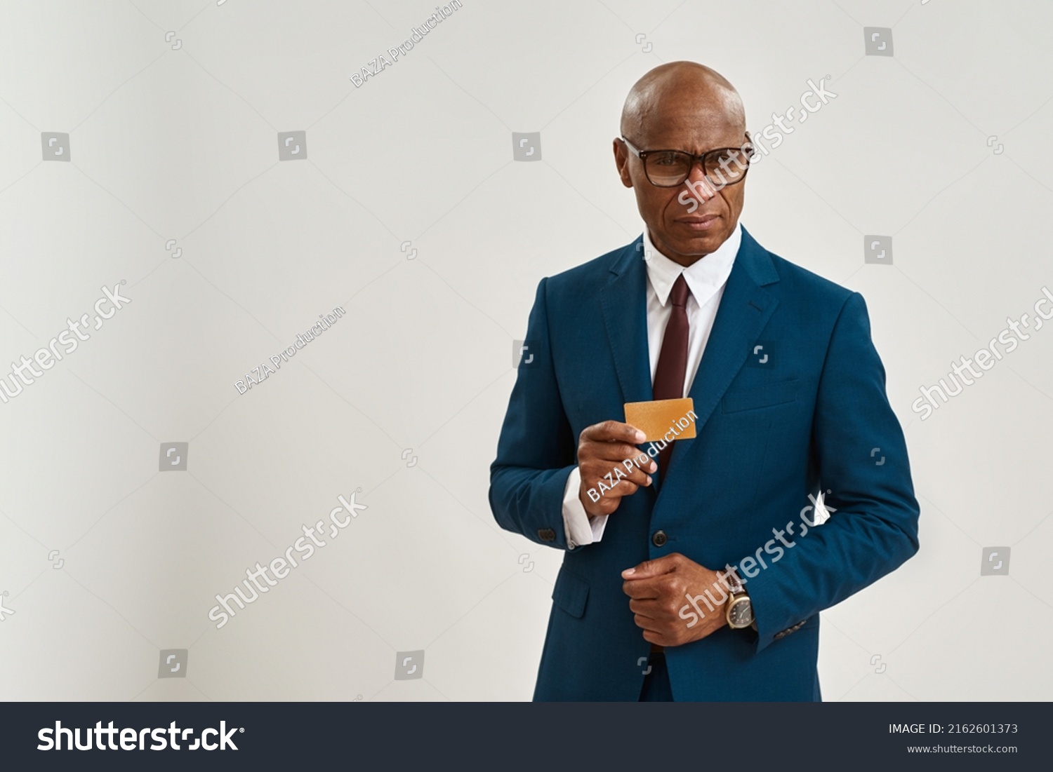 Serious Black Businessman Showing Golden Business Stock Photo ...