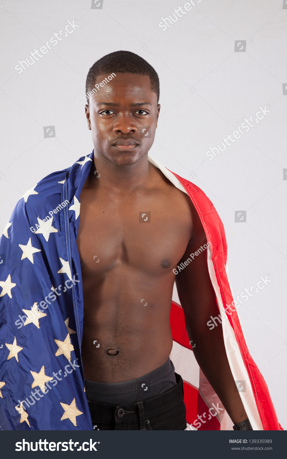 Serious Black Man With No Shirt On, Showing His Muscular Torso, With An ...