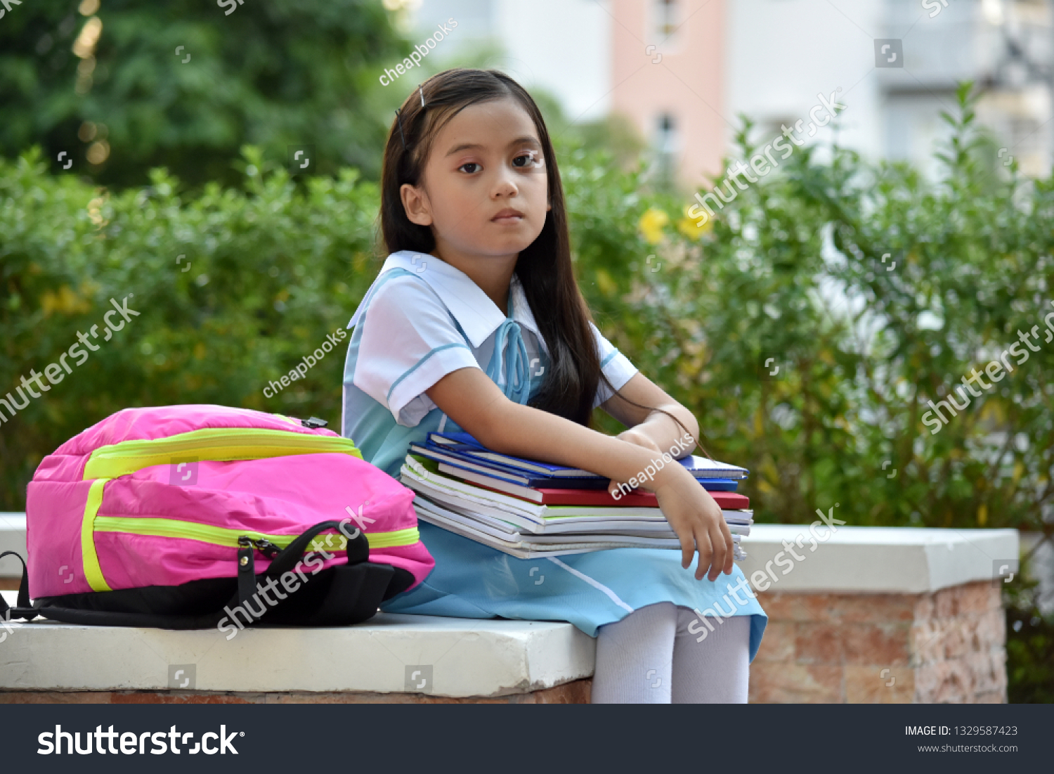 serious-school-girl-wearing-school-uniform-stock-photo-1329587423