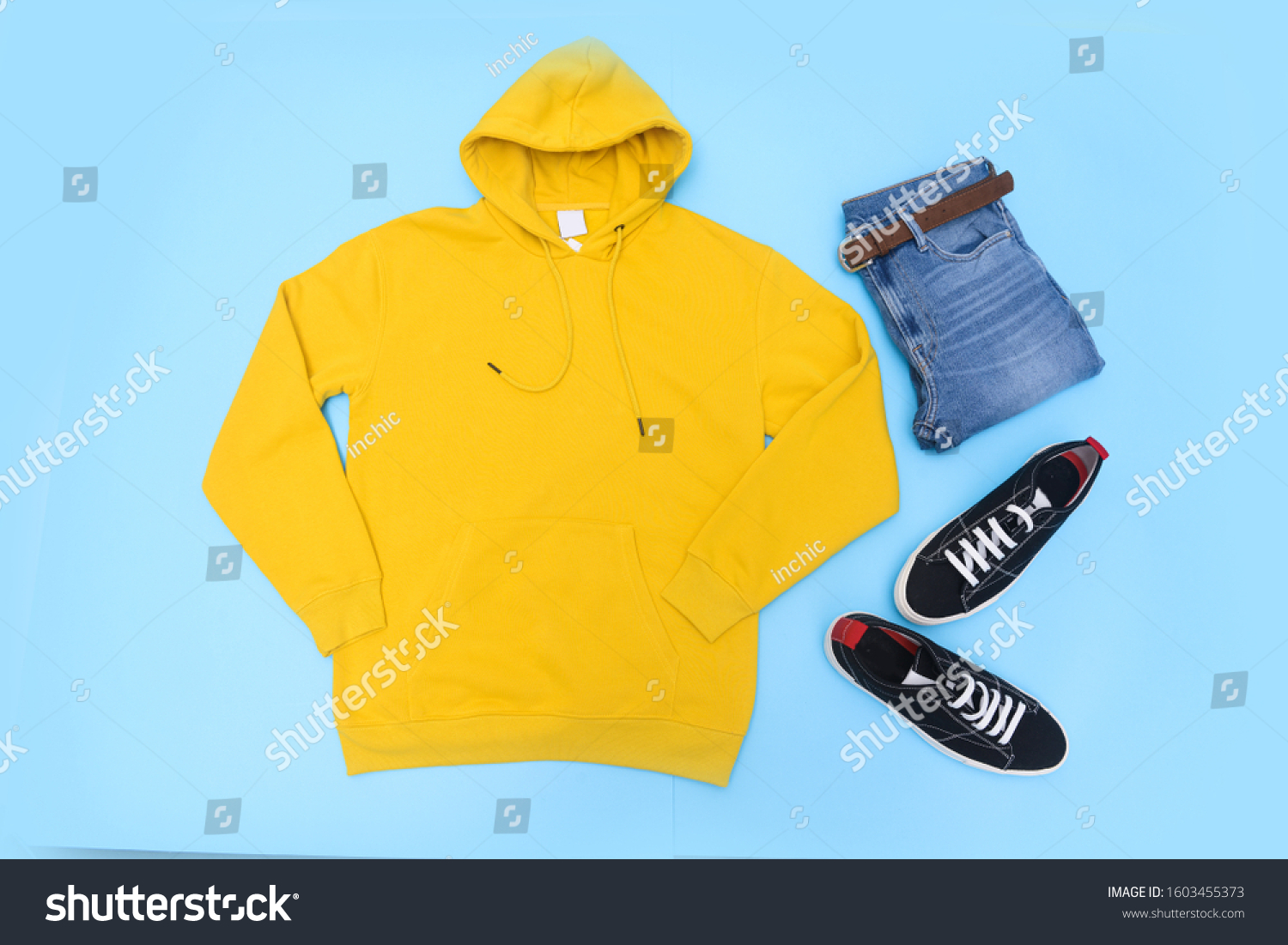 yellow hoodie black jeans