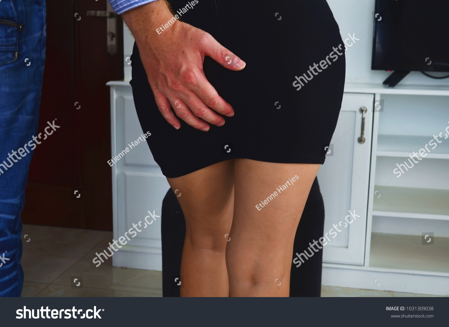 Sexual Harassment At Work. Man Touching Woman's Butt. Stock Photo, Picture  And Royalty Free Image. Image 64261164.