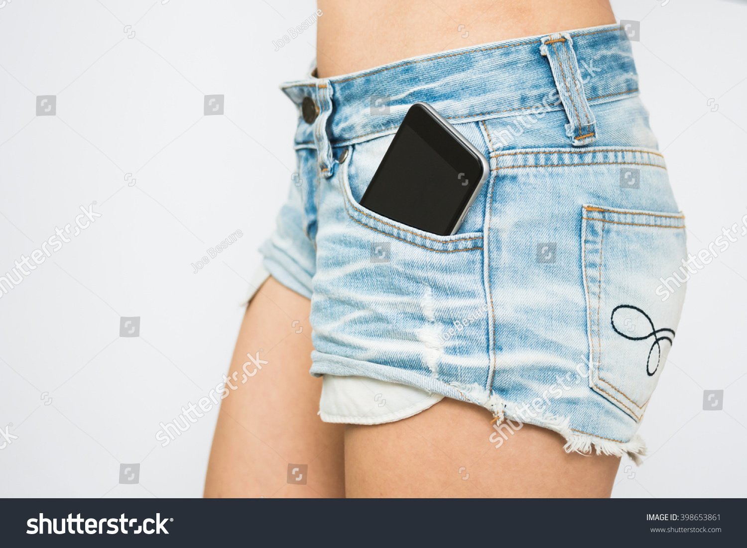 Photo De Stock Sexy Girl Jeans Shorts Smart Phone 398653861 Shutterstock