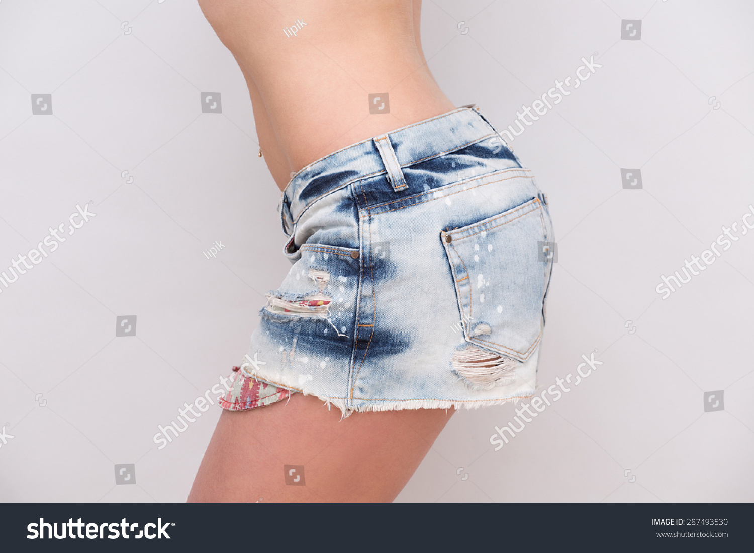 Sexy Girl Posing Teasing Jeans Shorts ภาพสต็อก แก้ไขตอนนี้ 287493530