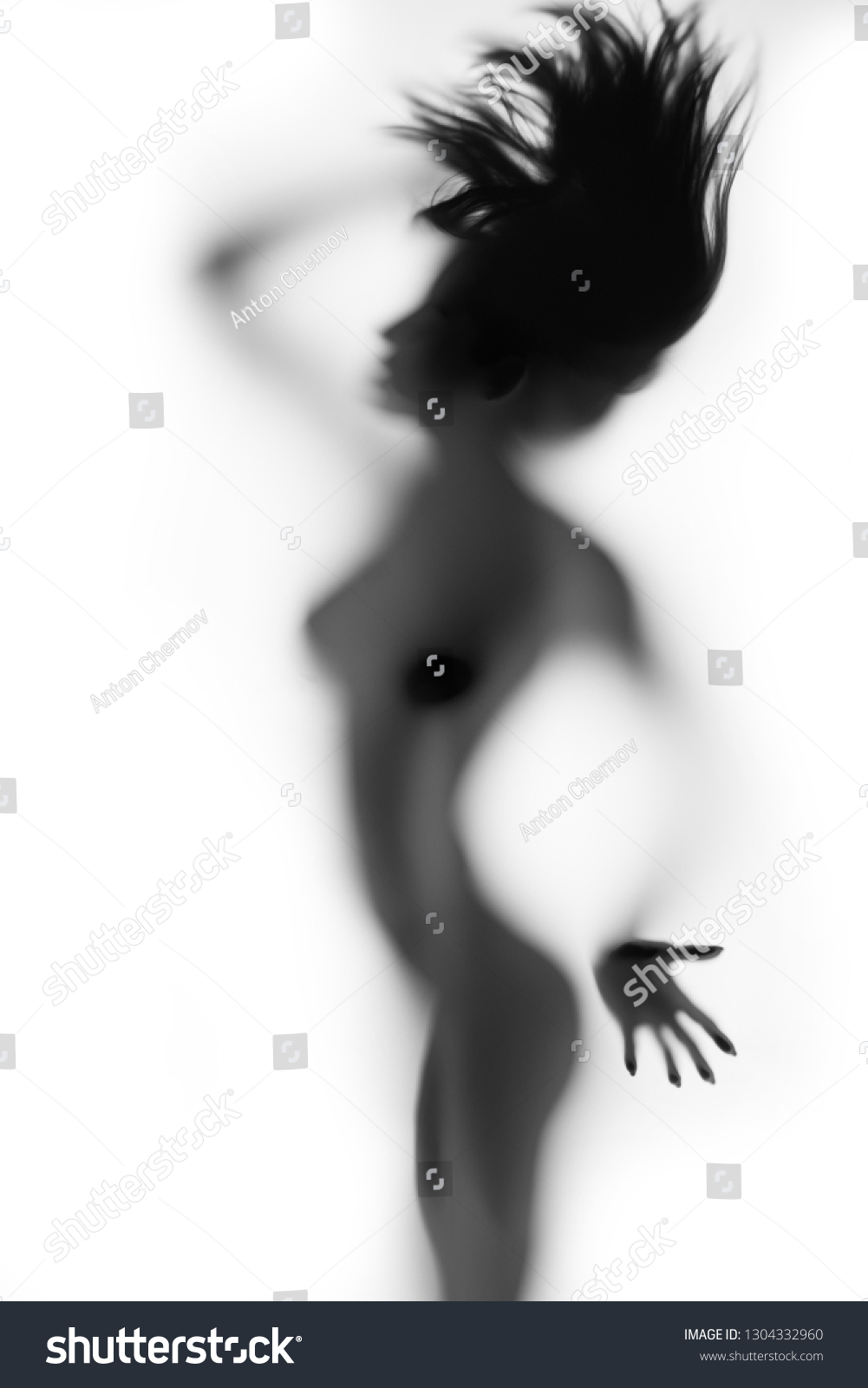 Sexy erotic womens body behind blurry glass