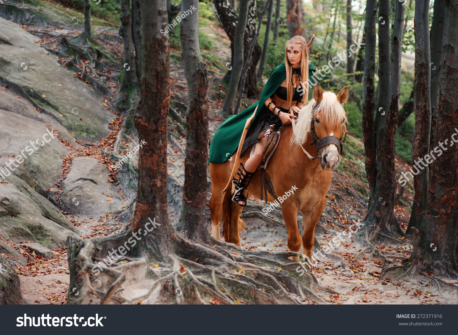 Sexy Woman Elf Warrior On Horseback In The Woods Stock Photo 272371916 ...