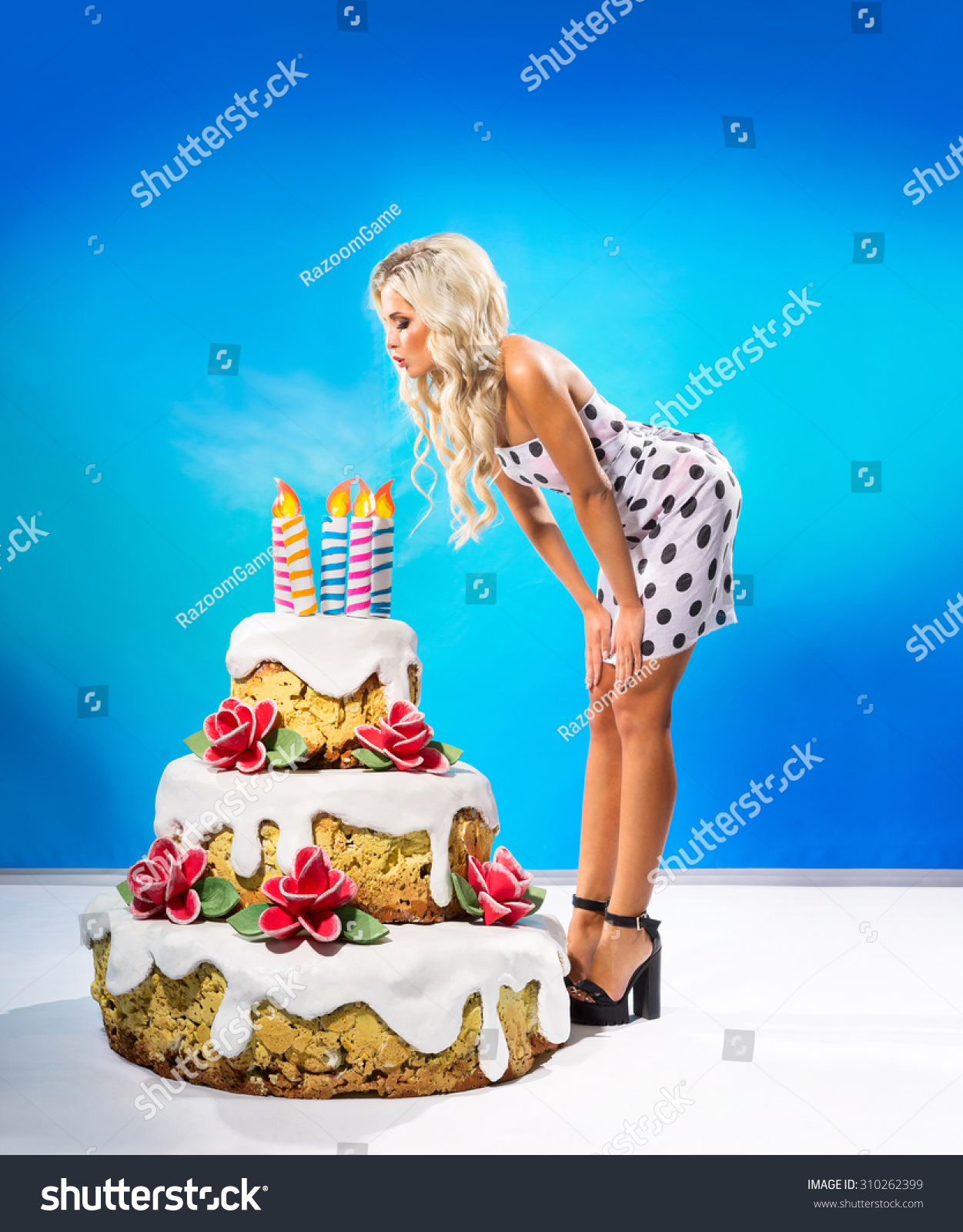 Sexy Young Woman Blows Out Candles Stock Photo 310262399 - Shutterstock