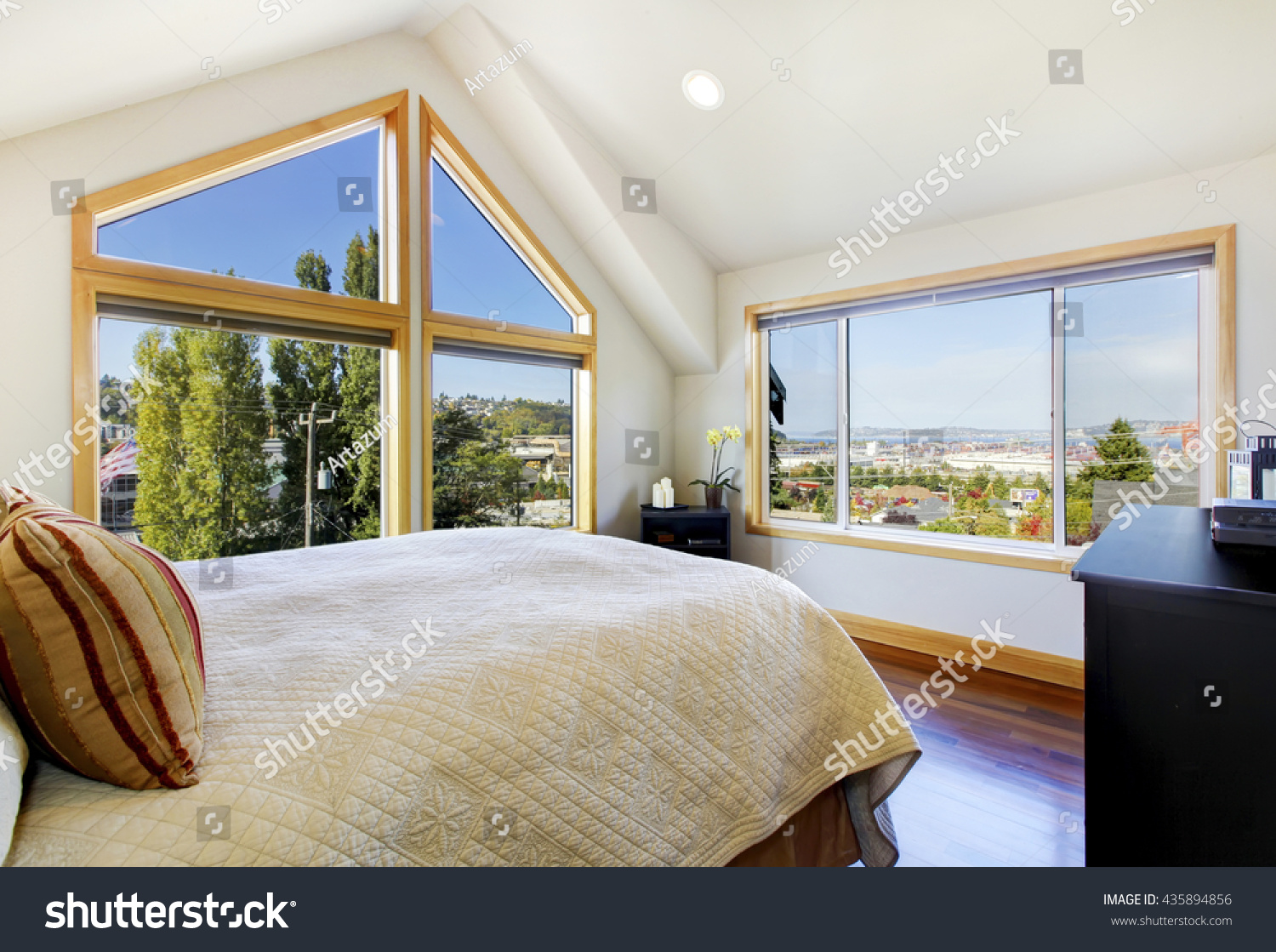 Stock Photo Shiny And Bright Bedroom With Vaulted Ceiling And Beautiful View 435894856 