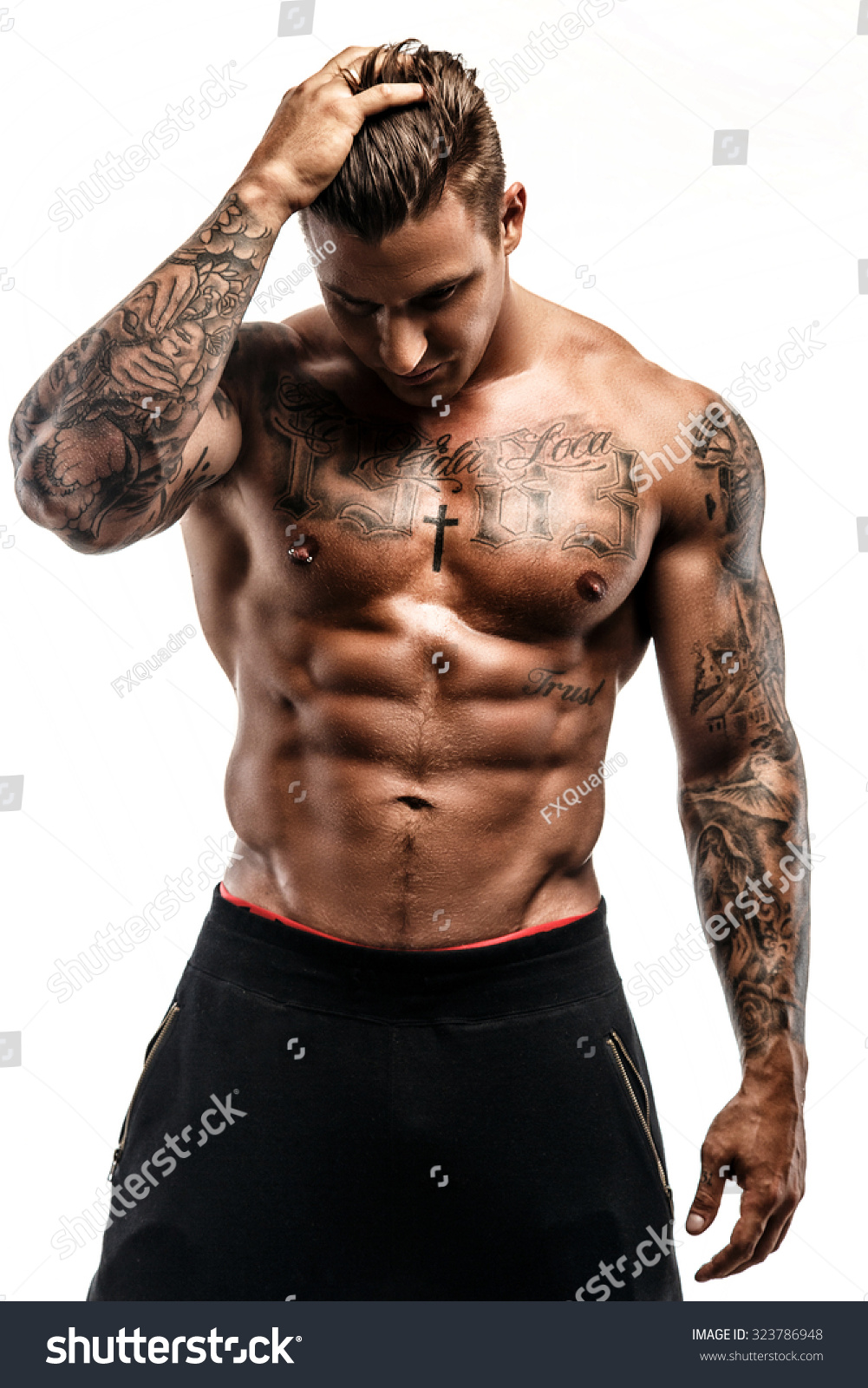 Shirtless Muscular Tattooed Man Isolated On Stock Photo 