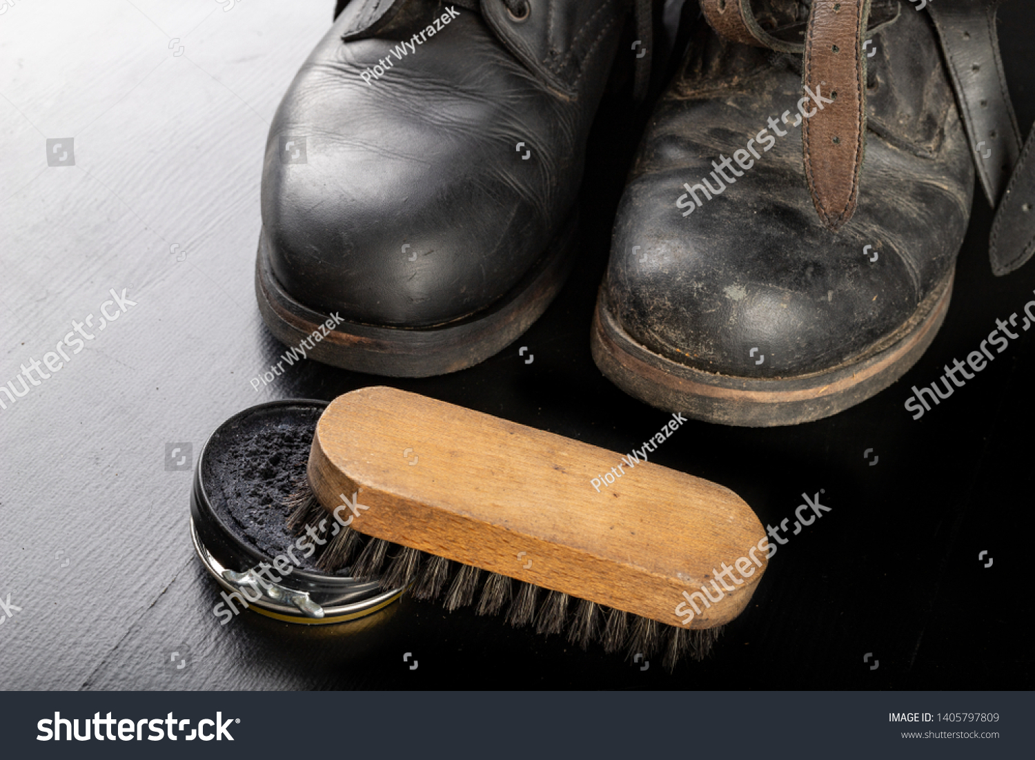 polishing black boots