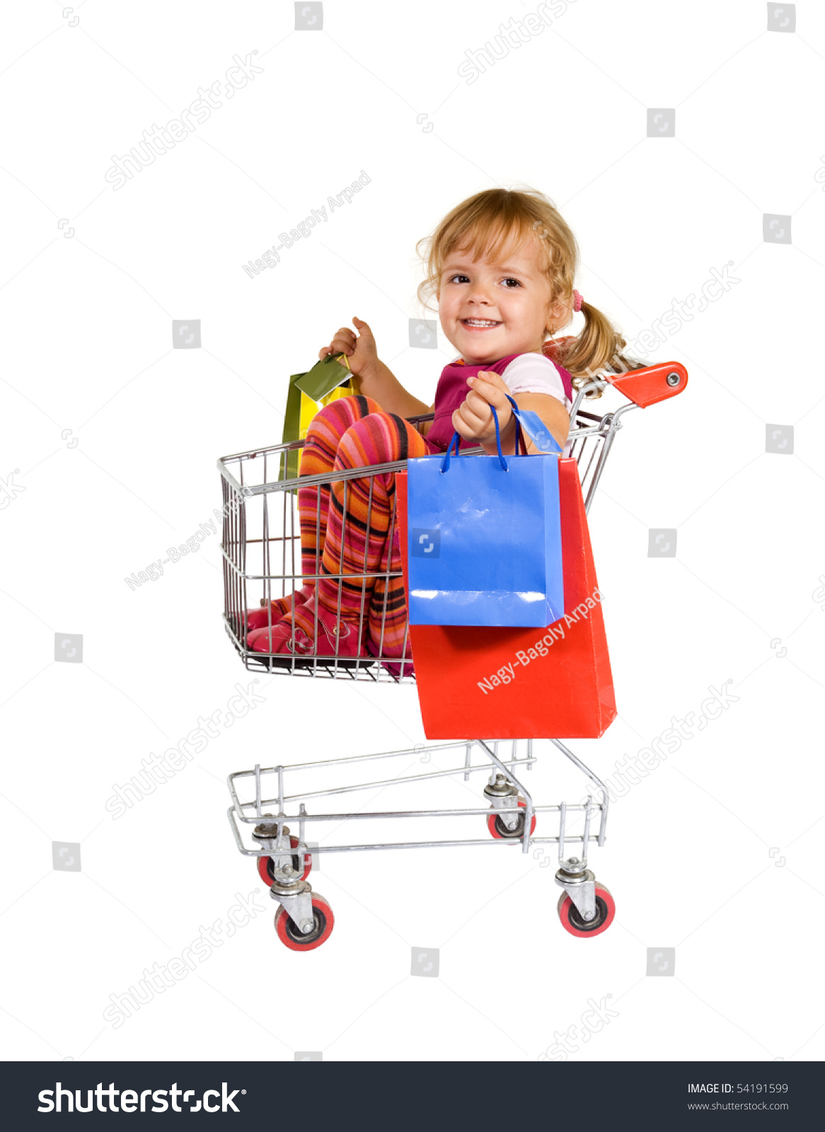 Shopping Is Fun - Little Girl Sitting In A Cart With Colorful Bags ...