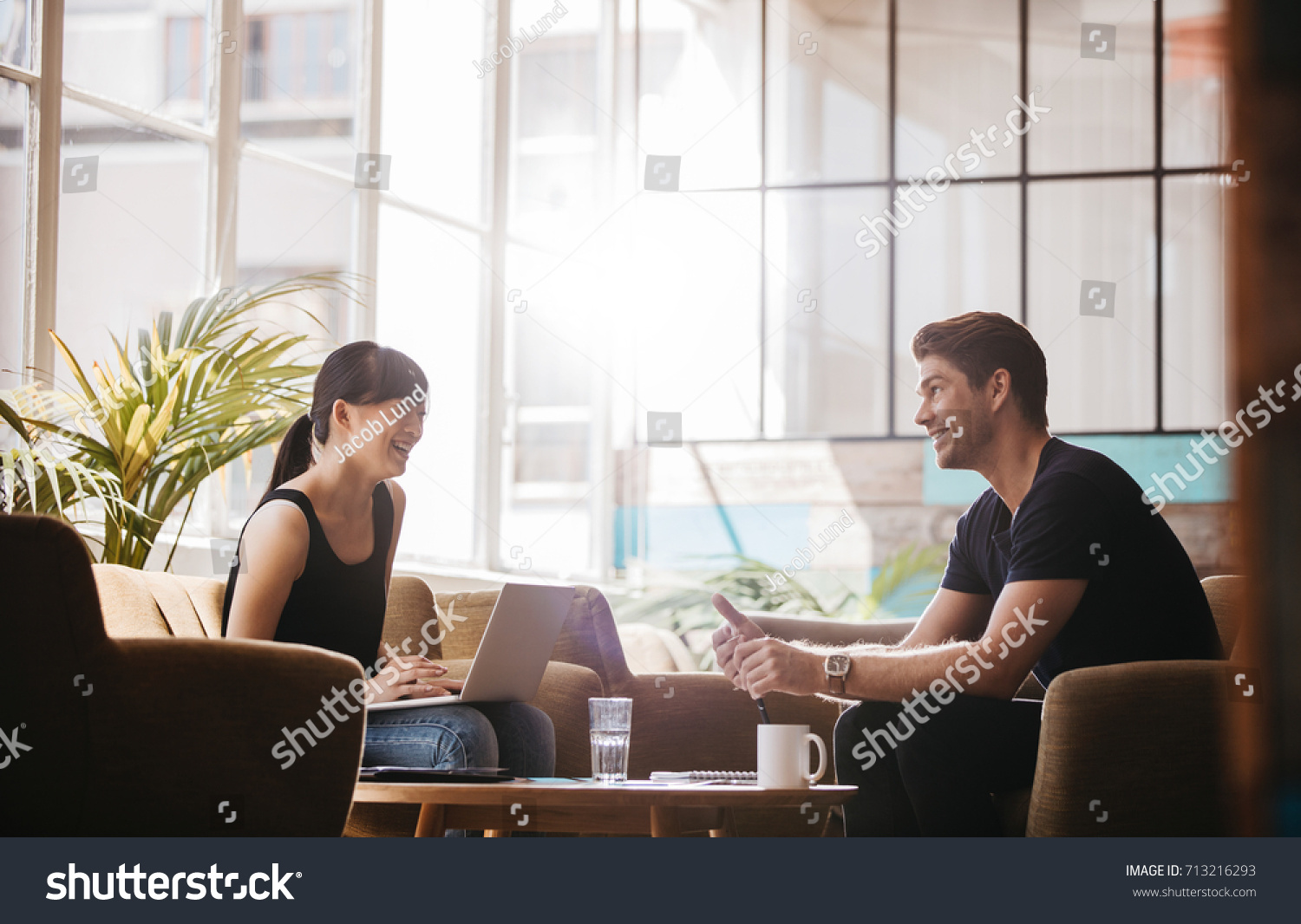 Shot Two People Sitting Office Lobby Stock Photo Edit Now 713216293