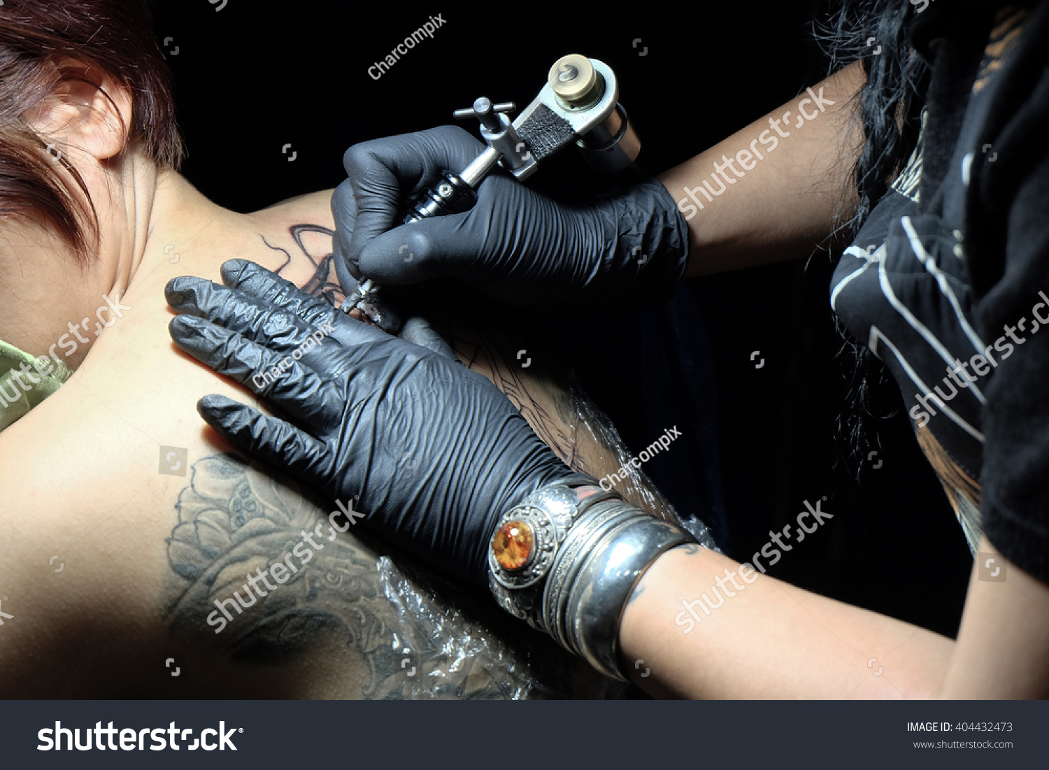 showing process making tattoo by professional stock photo showing process making tattoo by professional stock photo