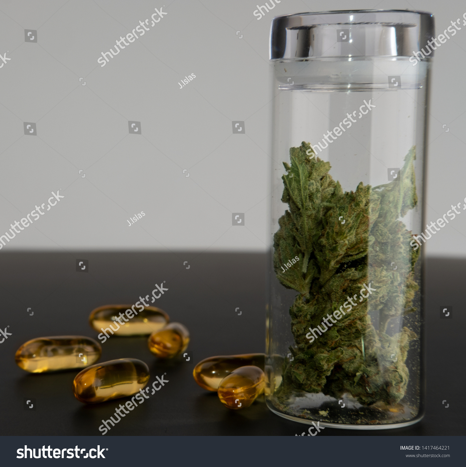 Download Side View Glass Jar Marijuana Buds Stock Photo Edit Now 1417464221 PSD Mockup Templates