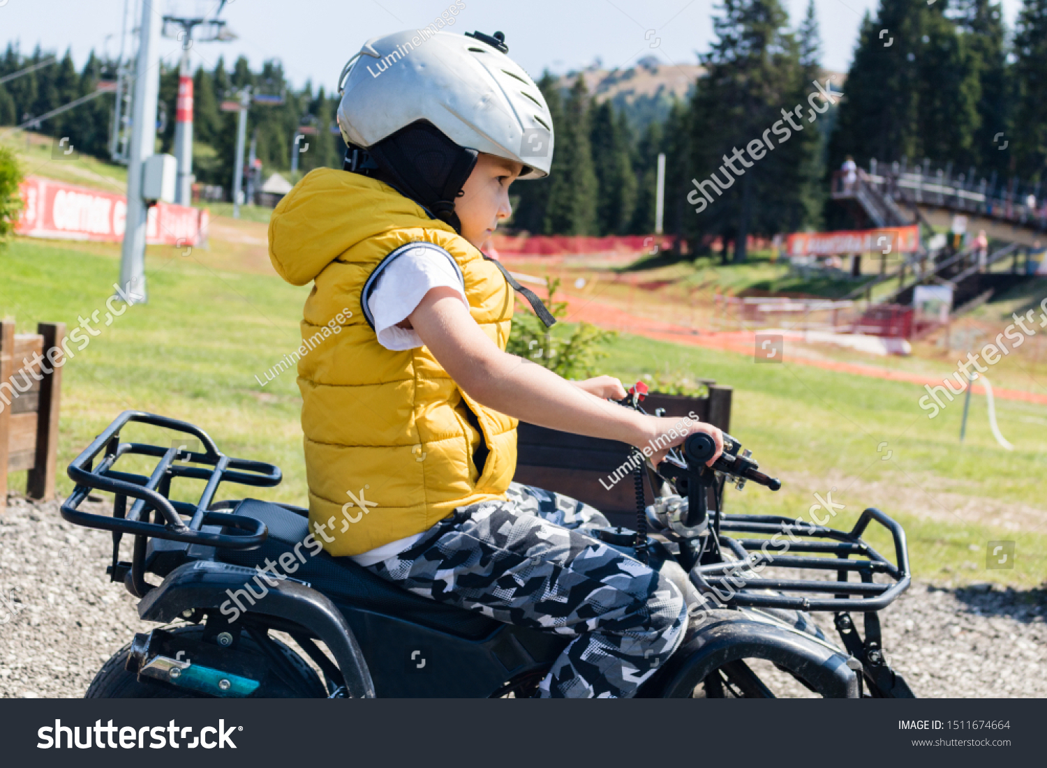 small boy driving bike
