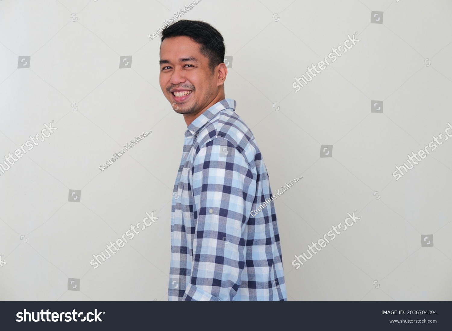 Side View Young Asian Man Smiling Stock Photo 2036704394 | Shutterstock