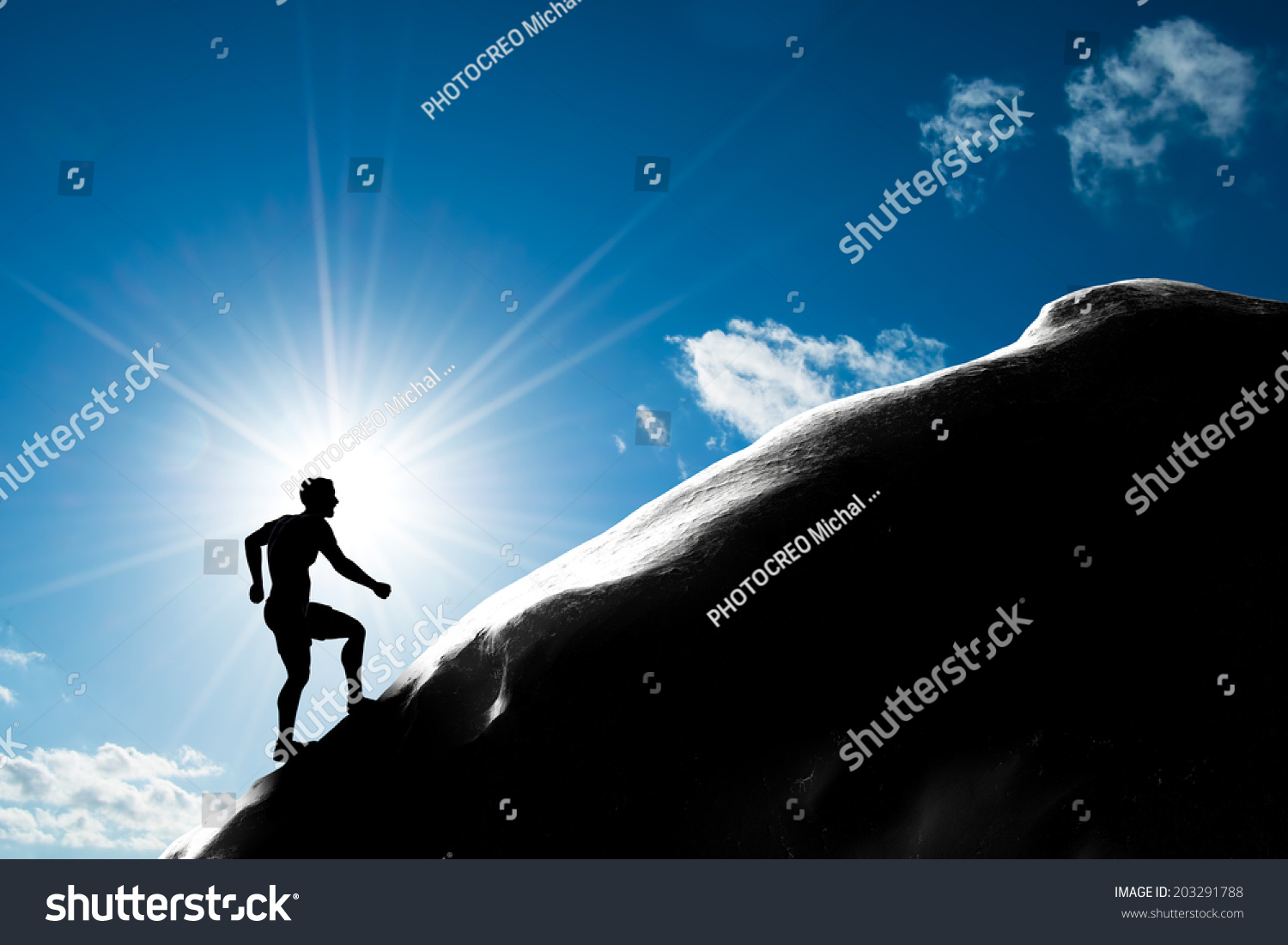 Silhouette Of A Man Running Up Hill To The Peak Of The Mountain ...