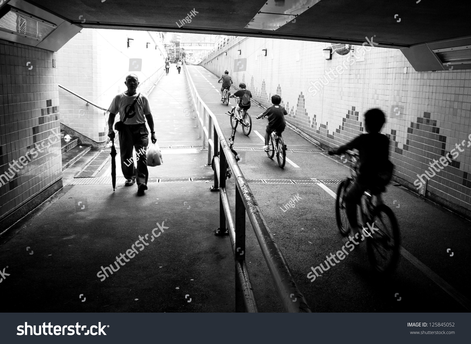 Silhouette Cycling Kids Father Old Walking Stock Photo 125845052 ... Silhouette Man Walking Tunnel