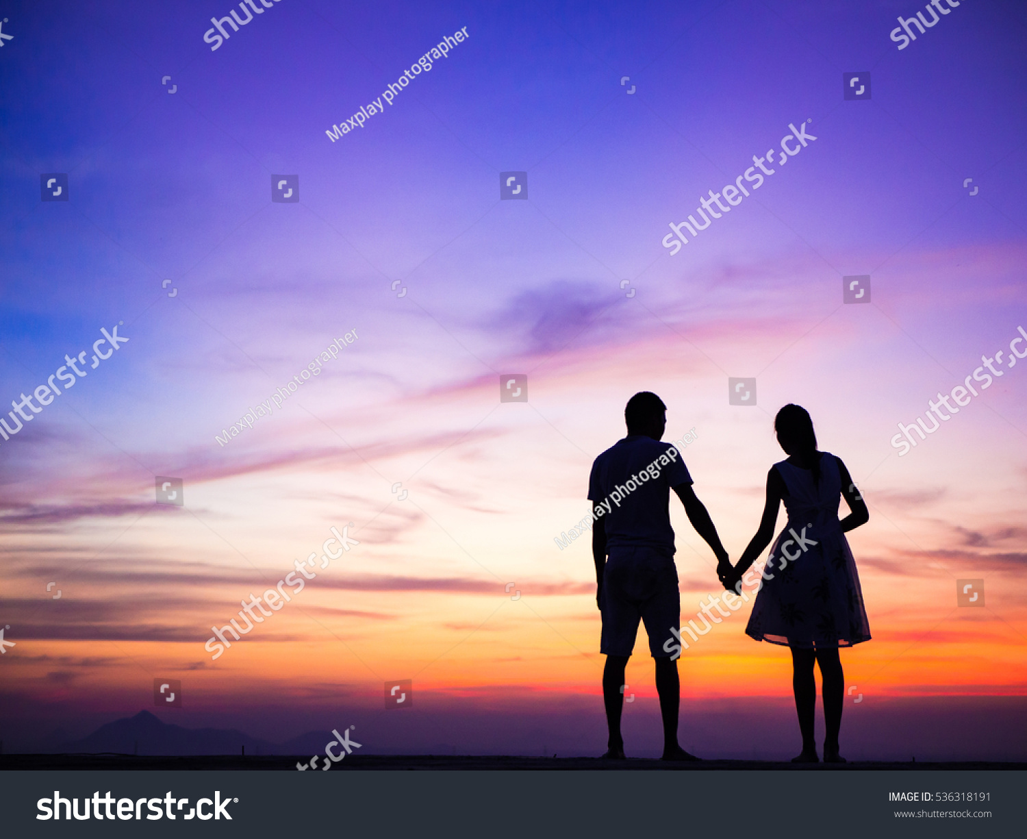 Silhouette Of Happy Young Couple Love Outside At Sunset Stock Photo ...