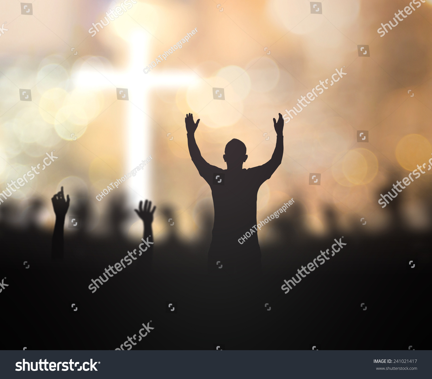 Silhouette People Raising Hands Over Blurred Crown Of Thorns And The ...