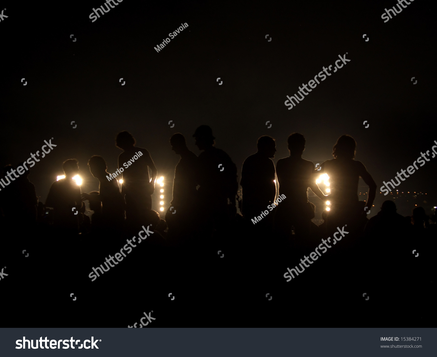 Silhouettes Of Rock Concert Audience, Backlit By Stage Lights, Standing ...