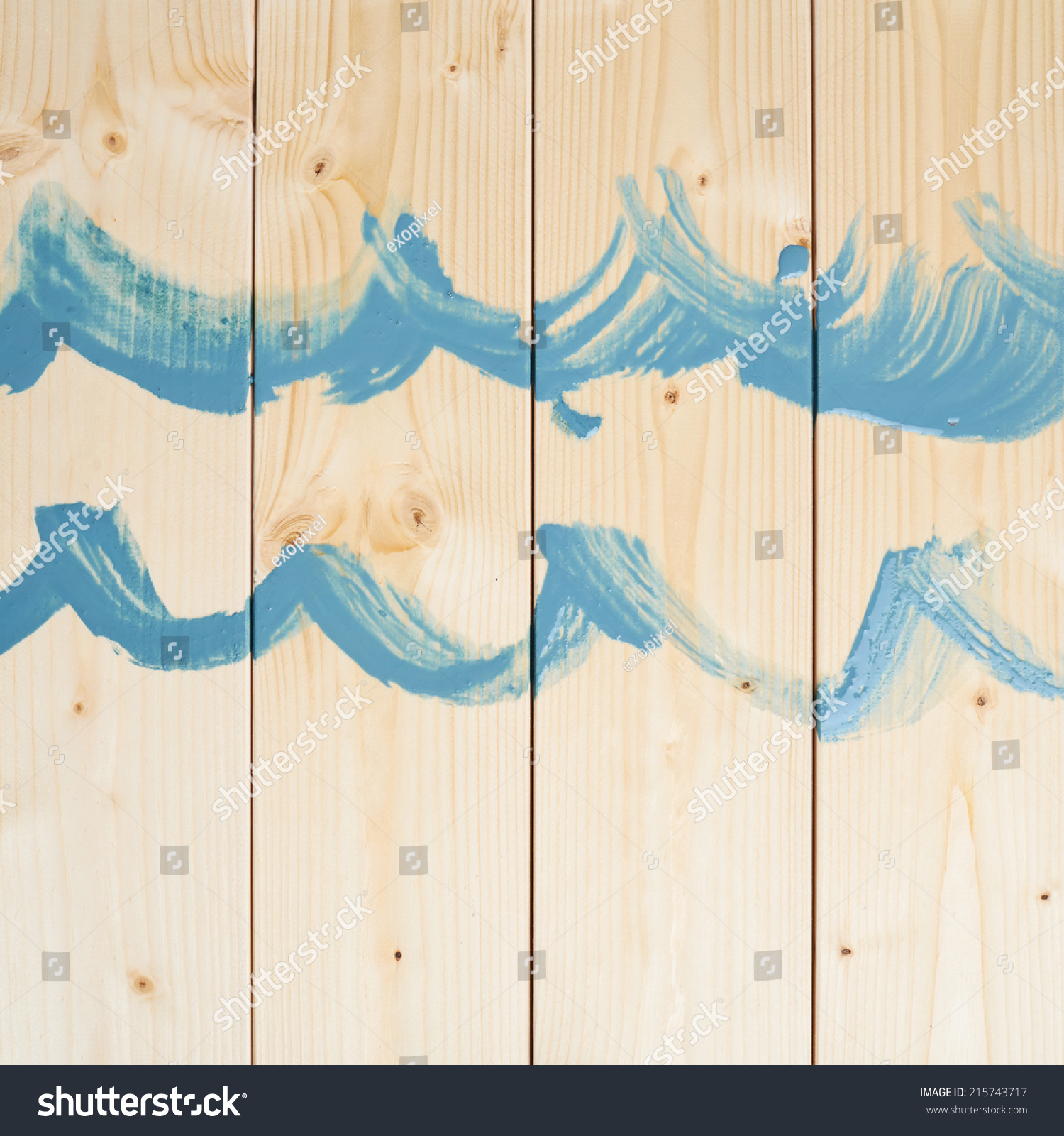 stock photo simple blue waves drawn with the paint over the pine wood boards 215743717