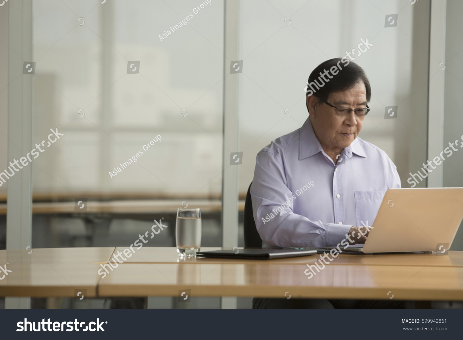 Singapore Senior Businessman Using Laptop Desk Stock Photo Edit