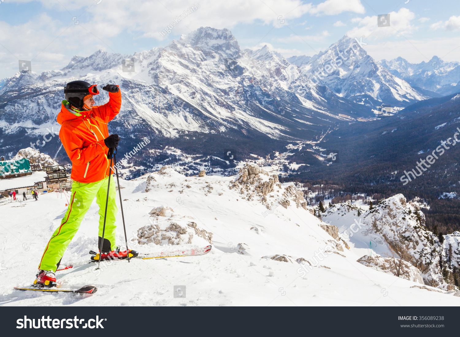 a skier standing at the top of the mountain