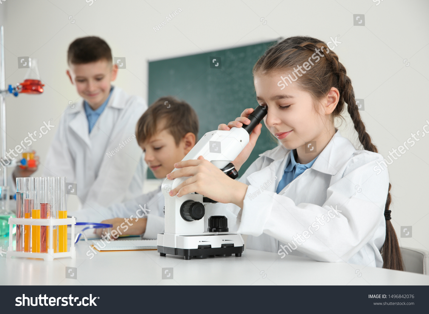 413 School boy looks through a microscope Images, Stock Photos ...