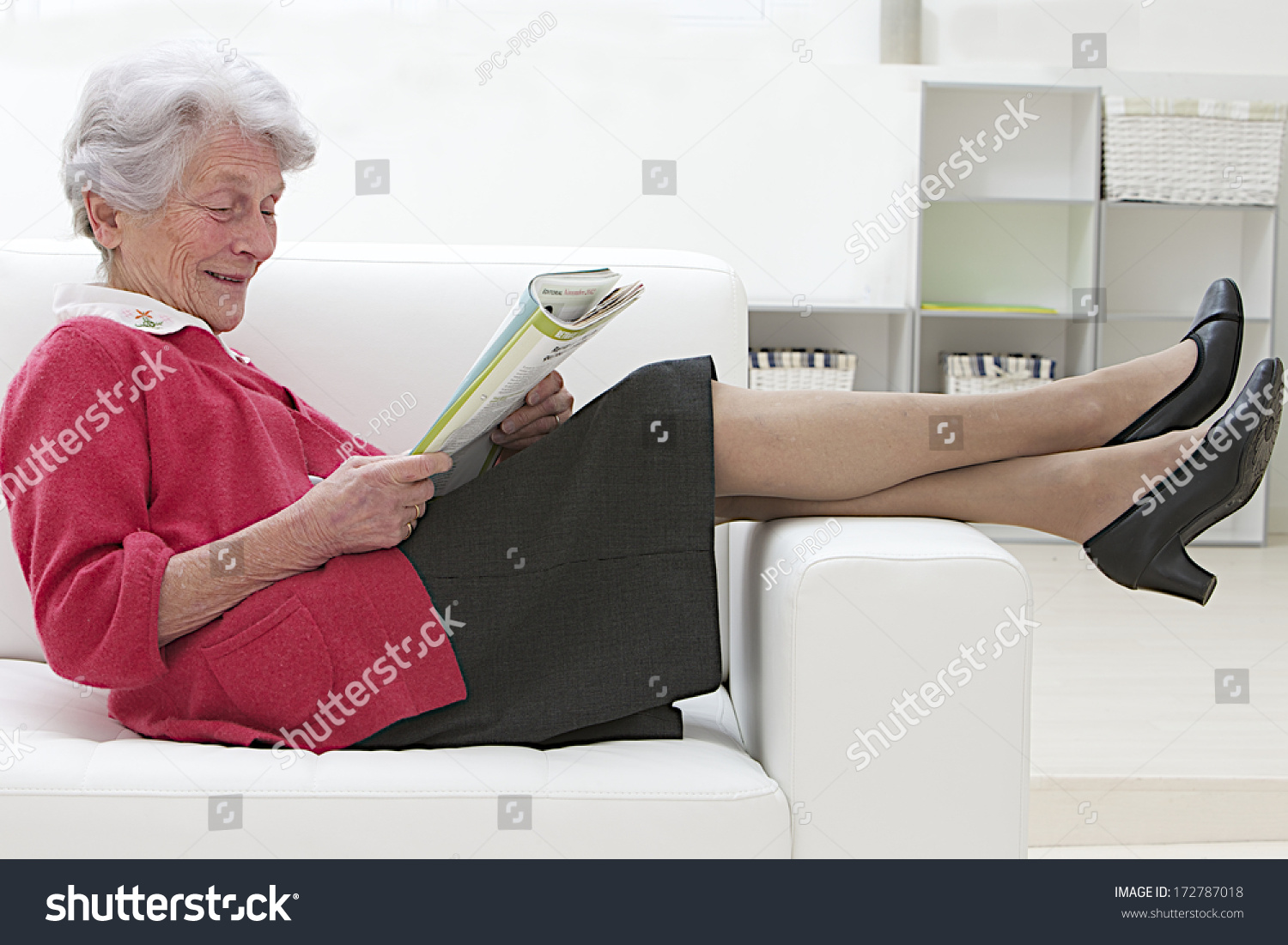 Smiling Elderly Woman Reading On Sofa Stock Photo 172787018 - Shutterstock