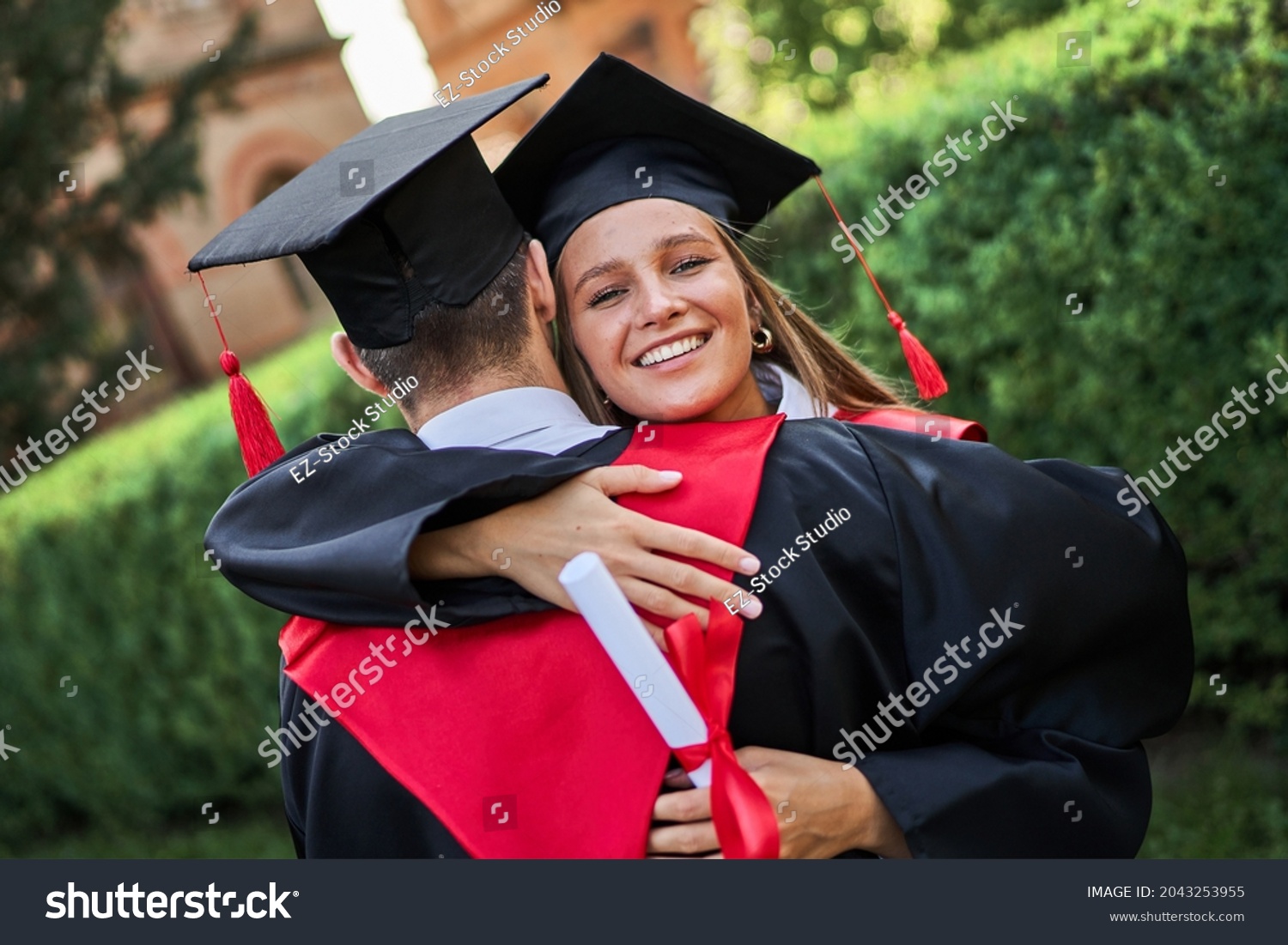 Smiling Female Graduate Hug Her Friend Stock Photo 2043253955 ...