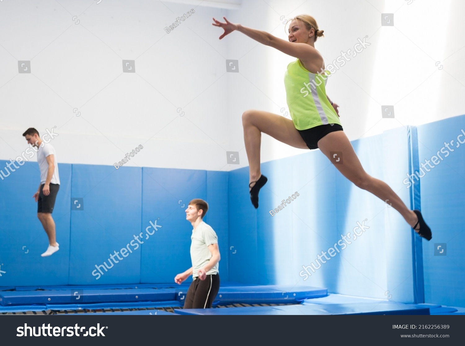 Smiling Female Gymnast Jumping Bouncing On Stock Photo 2162256389 ...