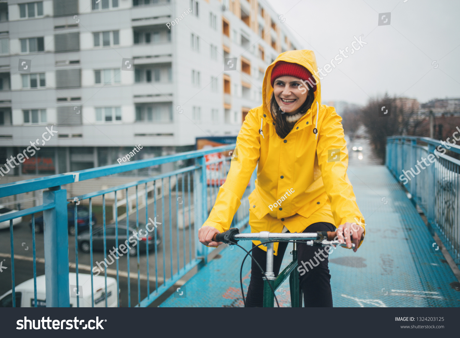 Smiling Girl Cycling Rain Wearing Raincoat Stock Photo 1324203125 ...