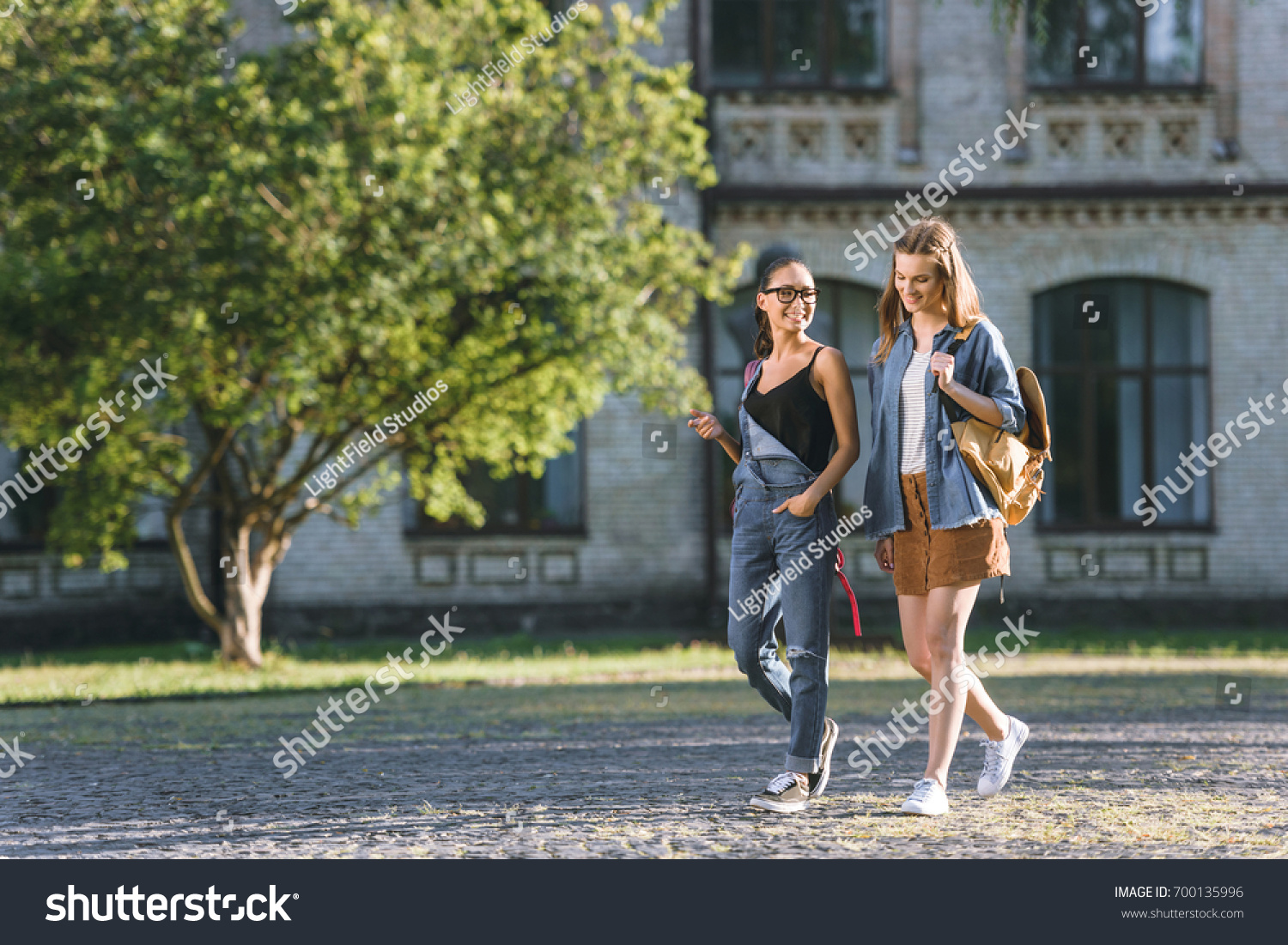 Smiling Multicultural Students Walking Together Park Stock Photo ...