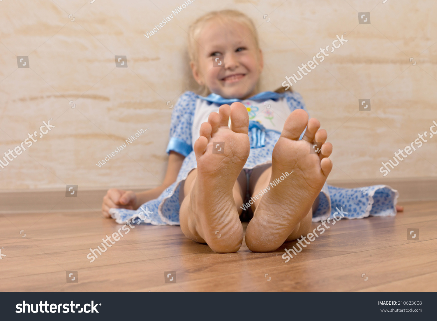 Smiling Young Girl Showing Feet On Foto Stok 210623608 Shutterstock