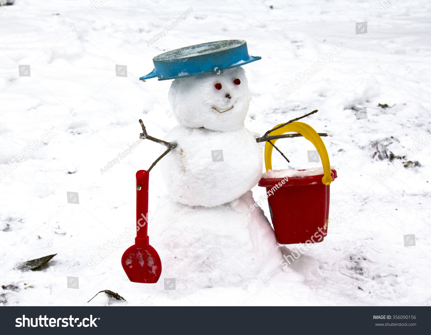 Snowman With A Red Bucket Against Snowdrifts Stock Photo 356090156 ...