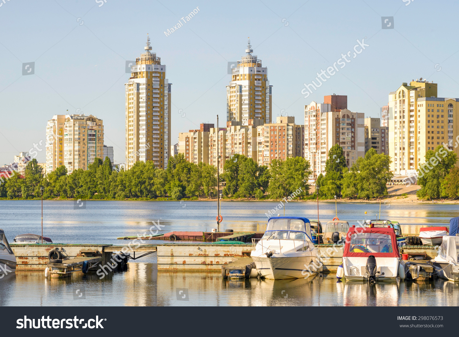 https://image.shutterstock.com/z/stock-photo-some-boats-are-parked-on-the-dnieper-river-in-kiev-ukraine-high-buildings-of-the-city-appears-in-298076573.jpg
