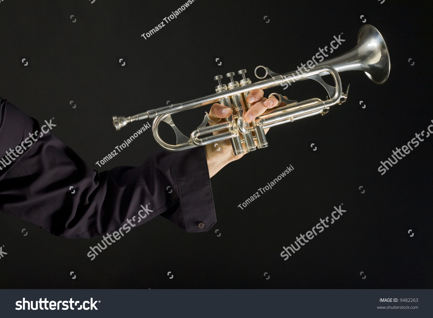Somebody Holding Trumpet On Dark Background. Stock Photo 9482263 ...