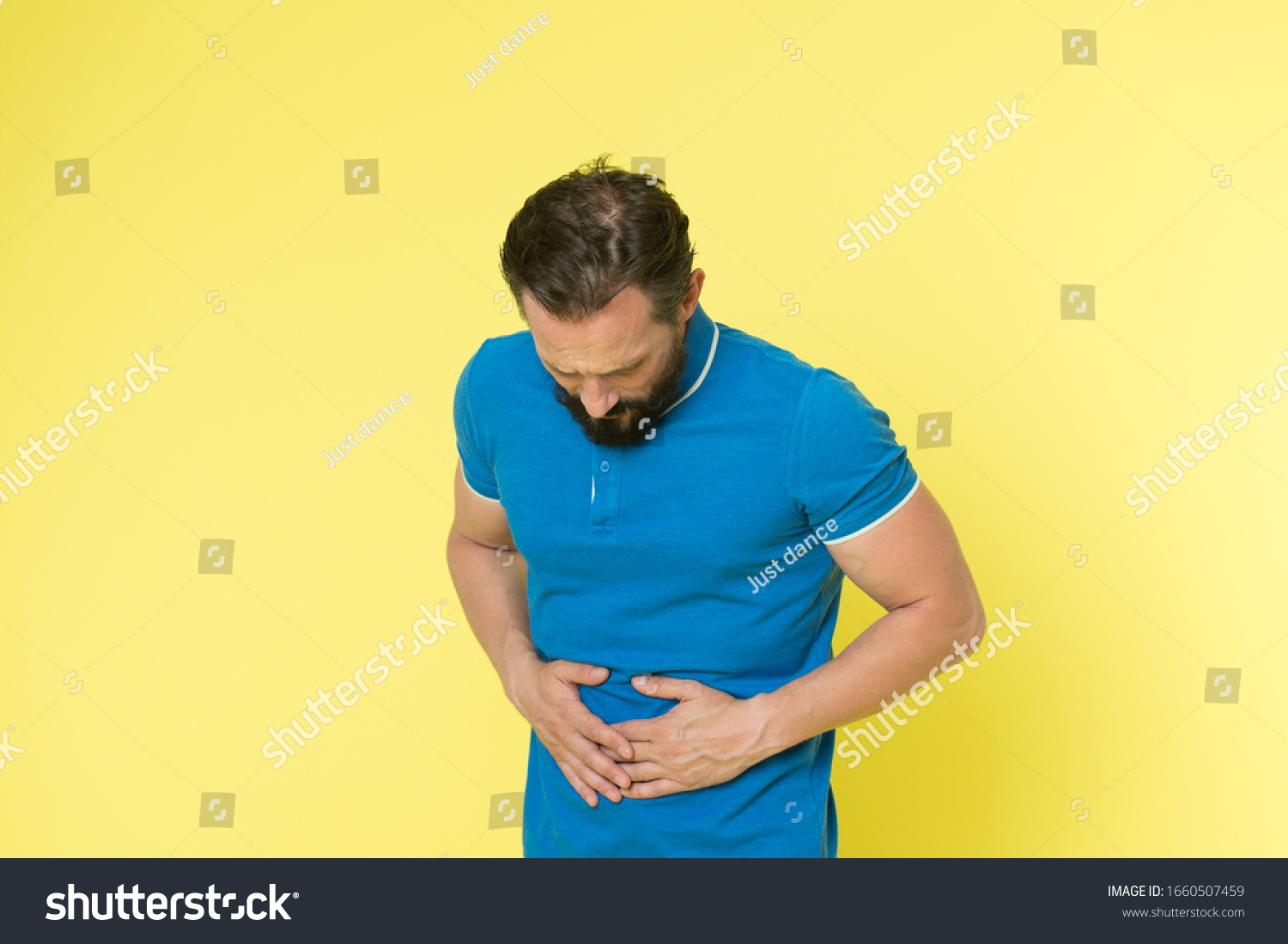 sore-stomach-killing-me-sick-man-stock-photo-1660507459-shutterstock