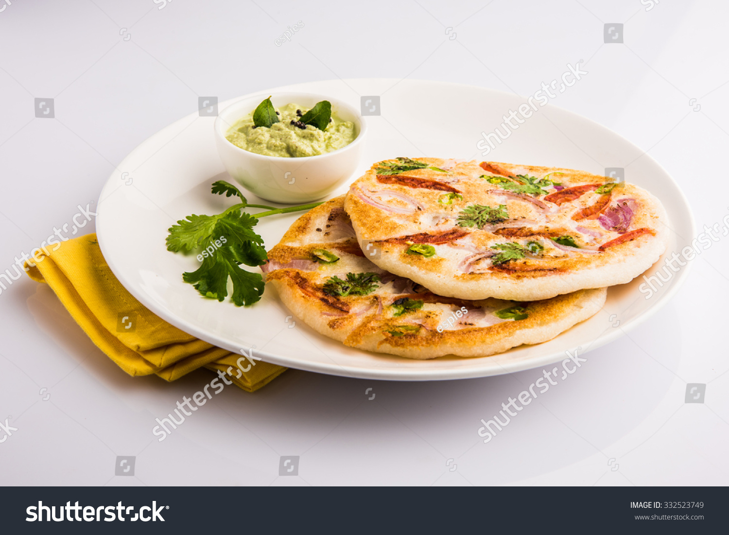 https://image.shutterstock.com/z/stock-photo-south-indian-food-two-uttapam-with-coconut-chutney-in-white-ceramic-plate-with-coriander-leaf-332523749.jpg