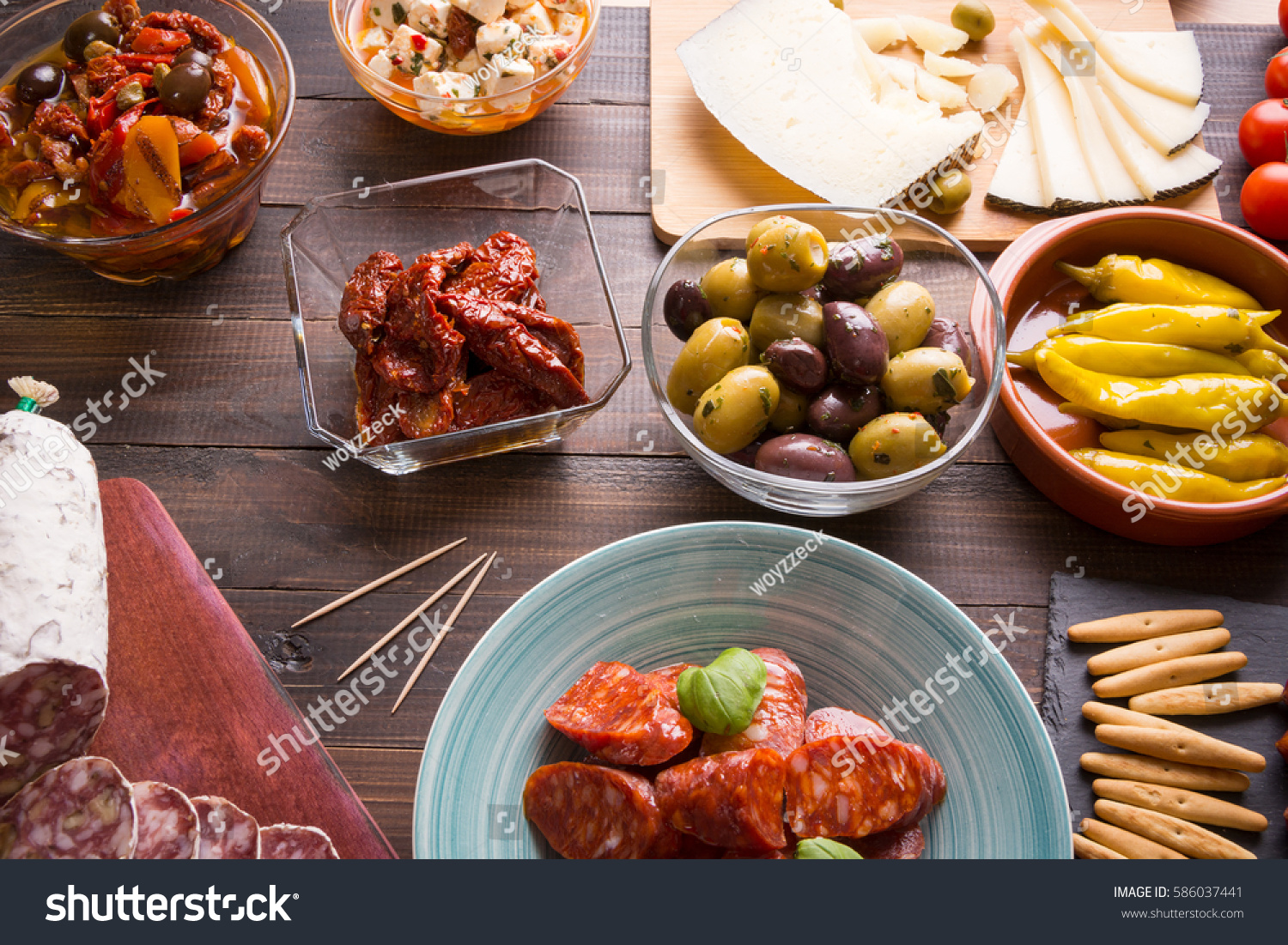 spanish-tapas-starters-on-old-wooden-stock-photo-586037441-shutterstock