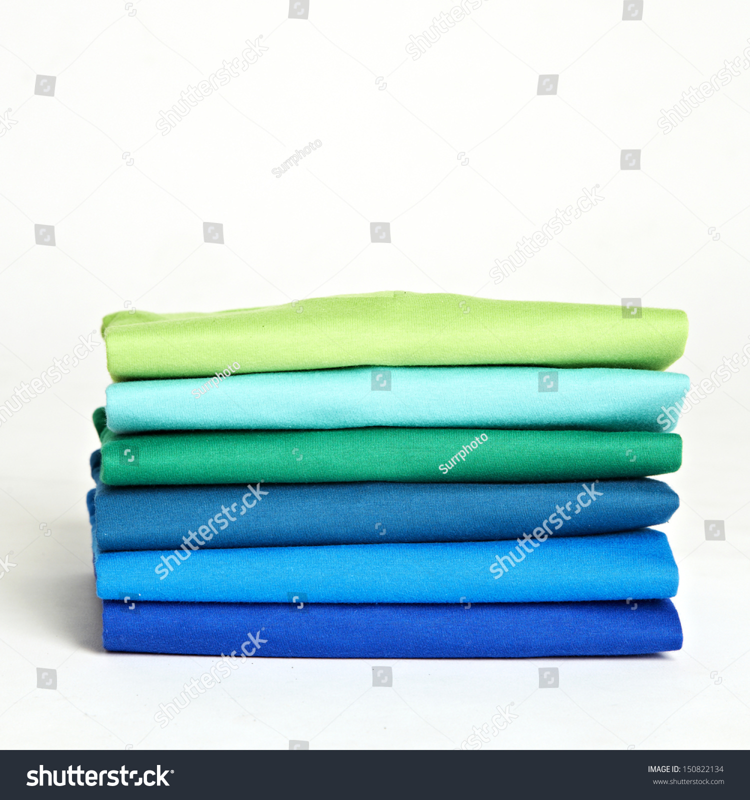 Stack Of Colorful T-Shirts On The White Background Stock Photo ...