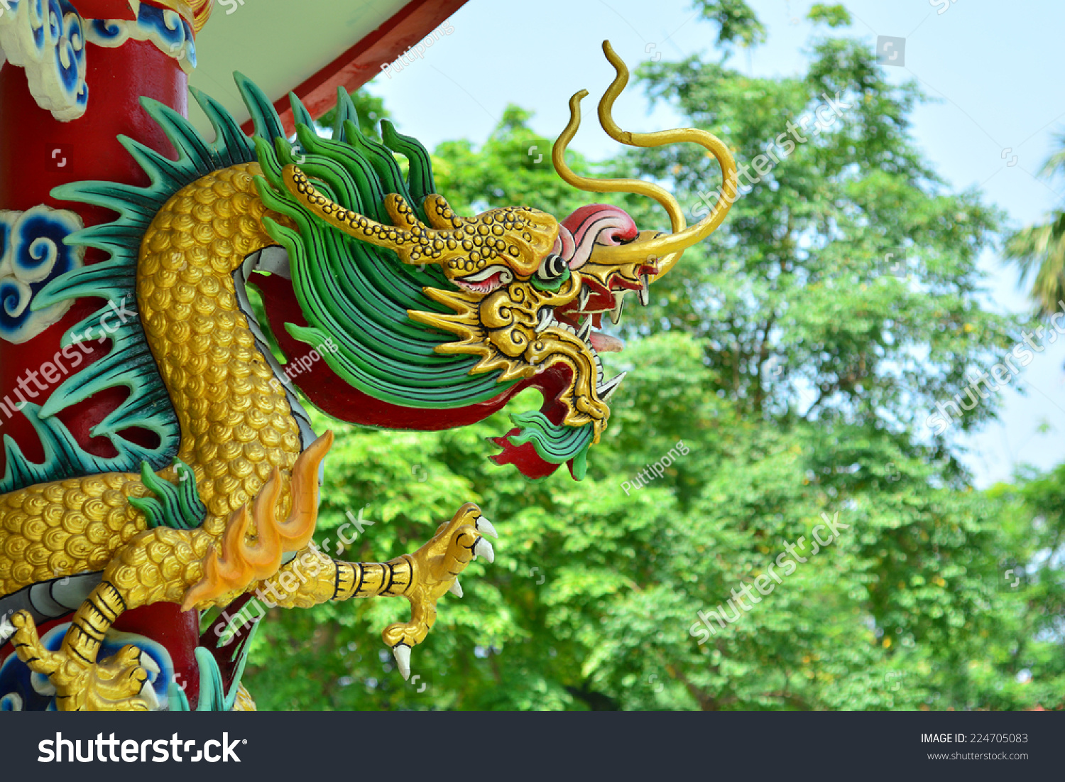 Statue Of A Dragon Wrapped Around A Pole Building. Stock Photo ...