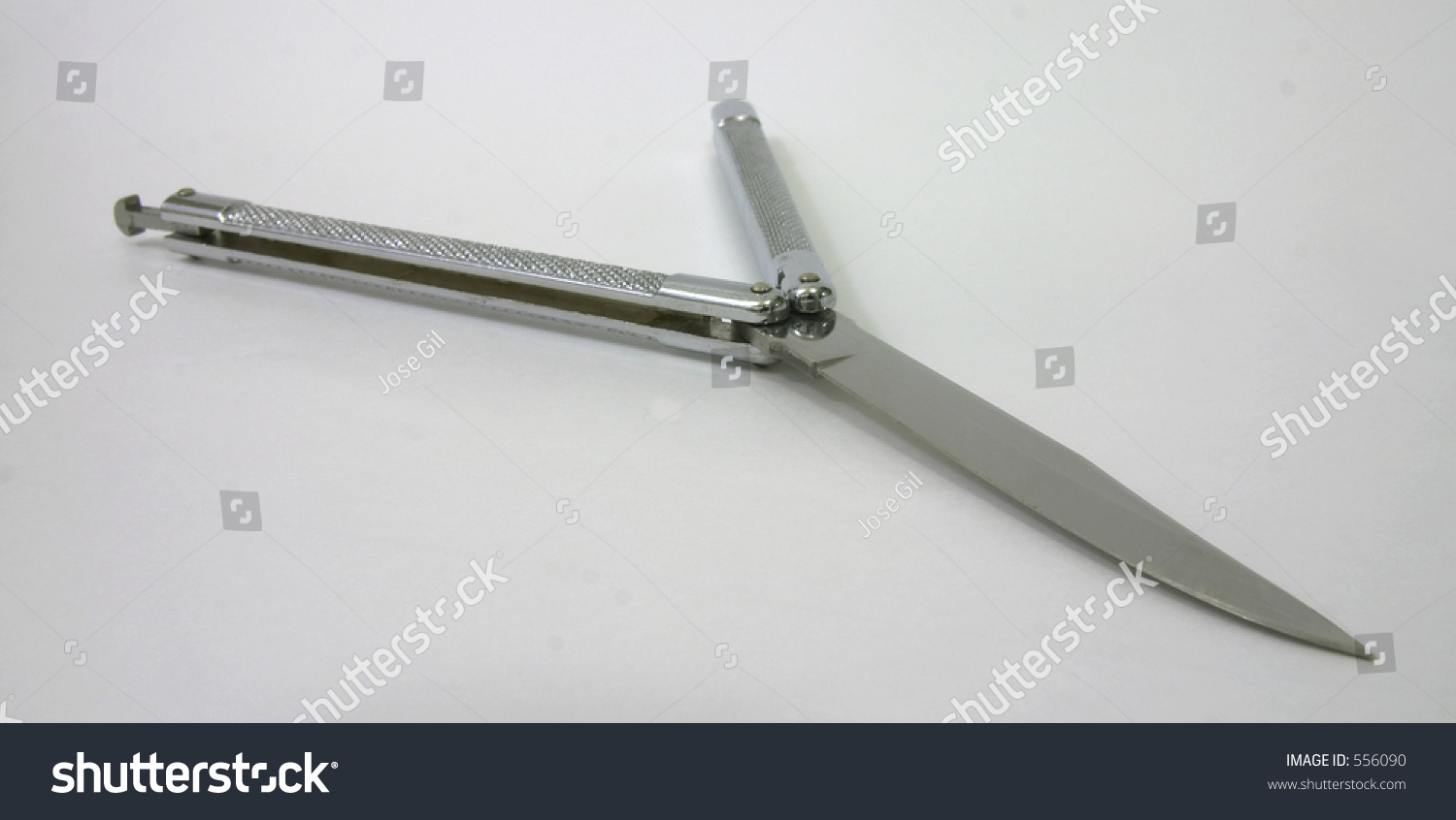 Steel Butterfly Knife (Balisong) On White Background, Partially Opened
