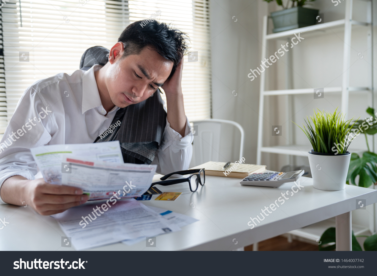 Stressed Young Asian Businessman Holding Many Stock Photo Edit