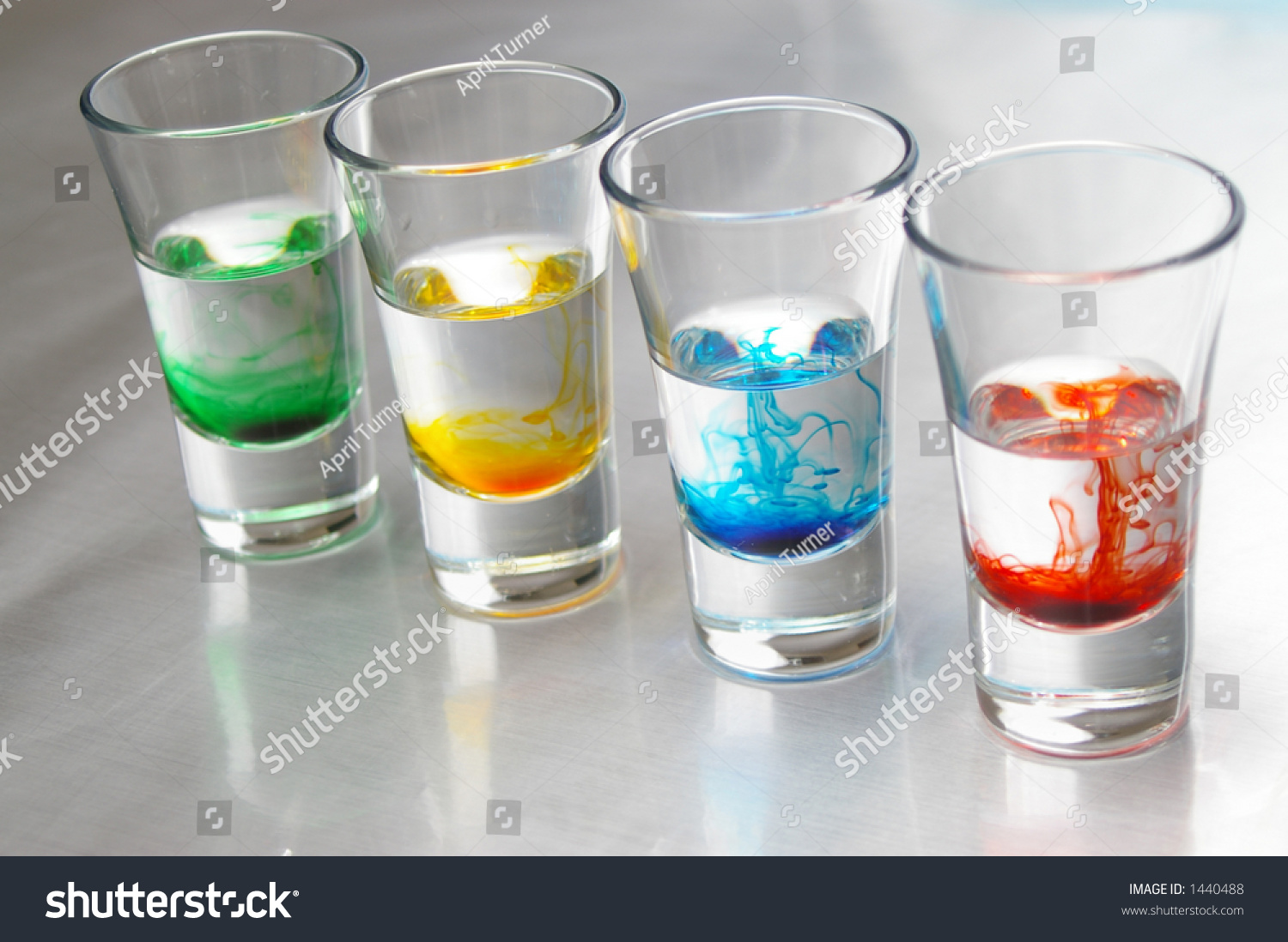 Strings Of Liquid Color Merge Into Water. Stock Photo 1440488 ...