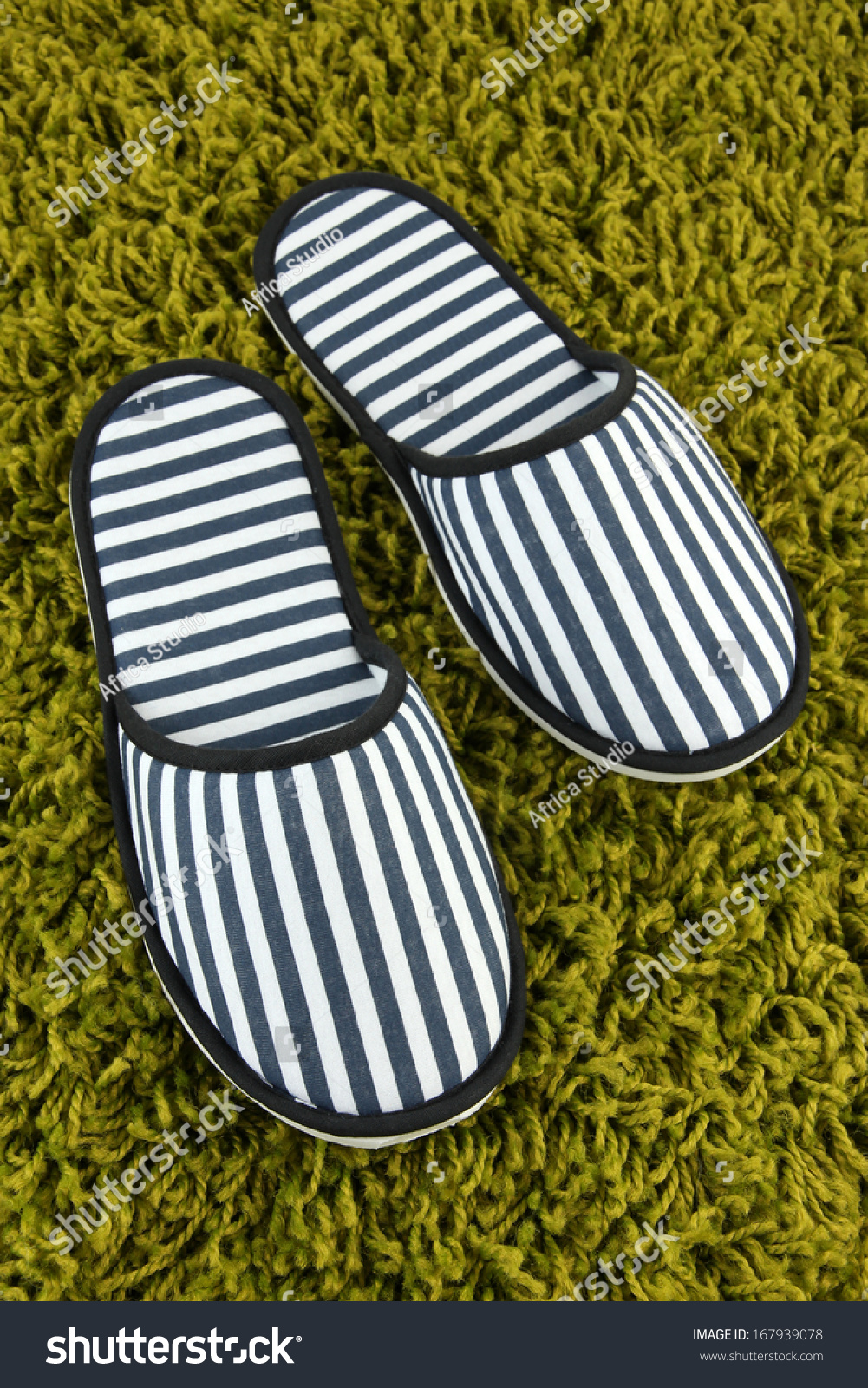 Striped Slippers On Carpet Background Stock Photo 167939078 : Shutterstock