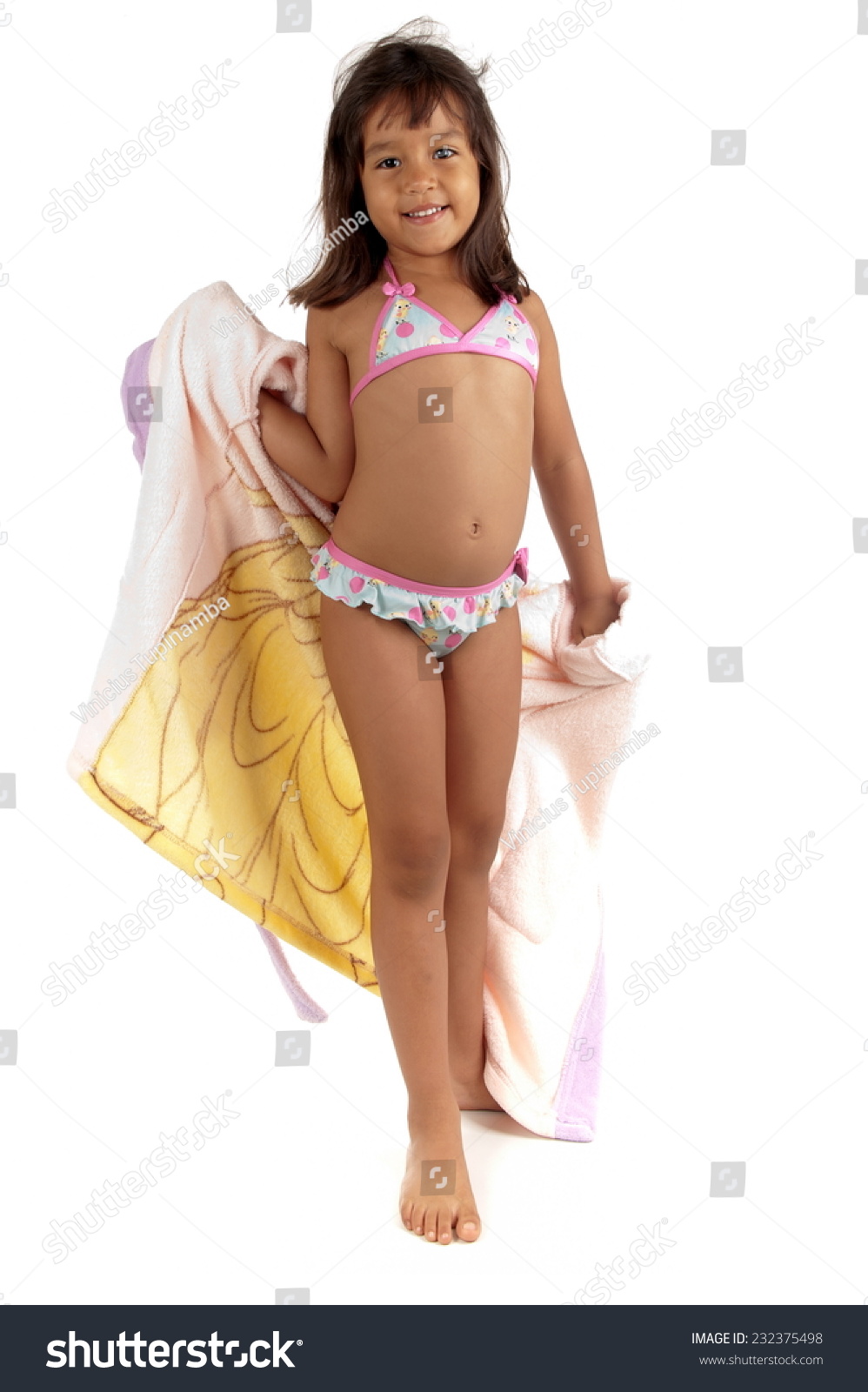 Studio Shot Of A Cute Child With Beach Bikini