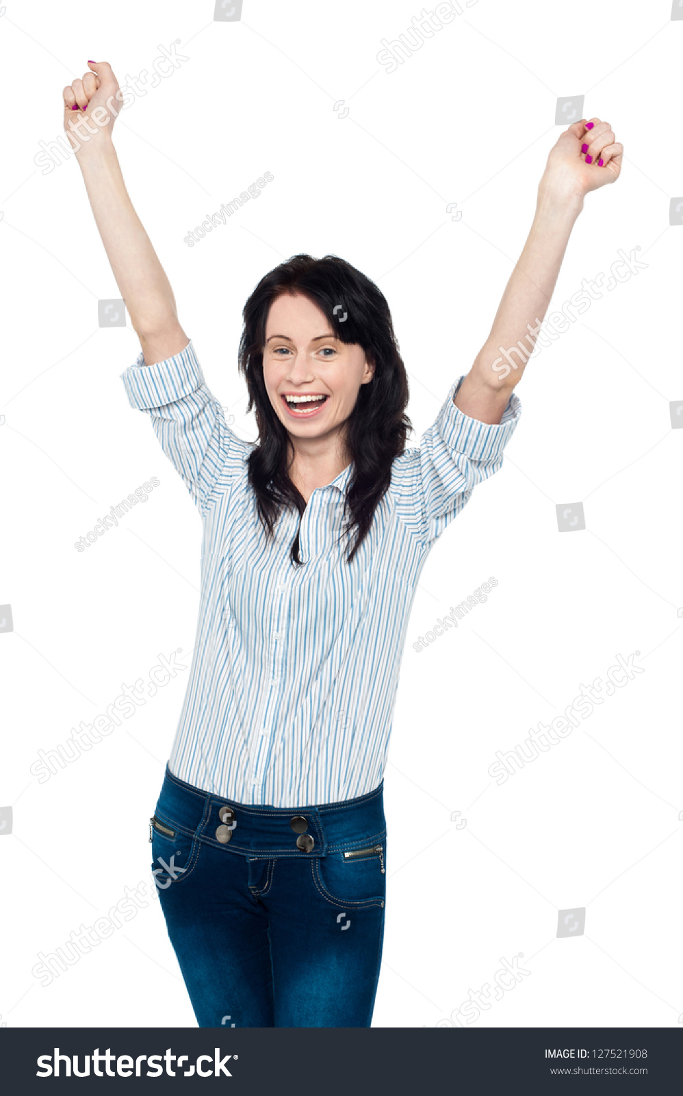 Studio Shot Of A Young Brunette Celebrating Her Success, Throwing Hands ...