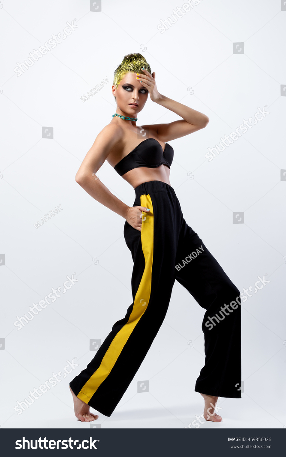 yellow pants with black stripe womens