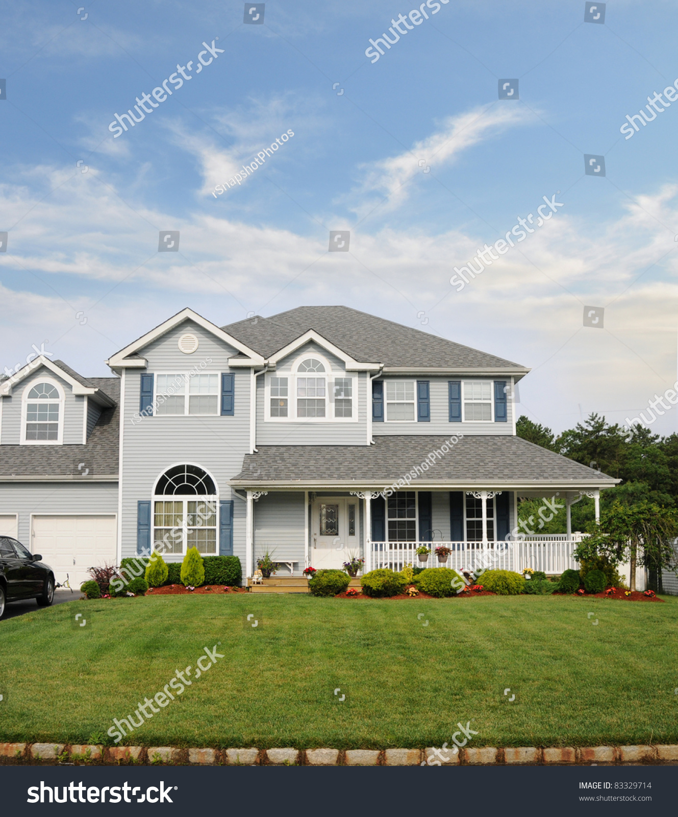 Suburban Two Story Home With Porch Landscaped Front Yard Stock Photo ...